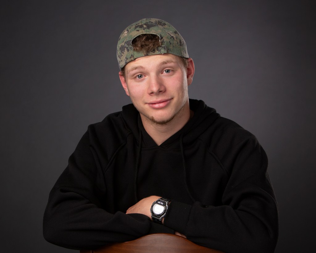 Teenager with baseball cap headshot