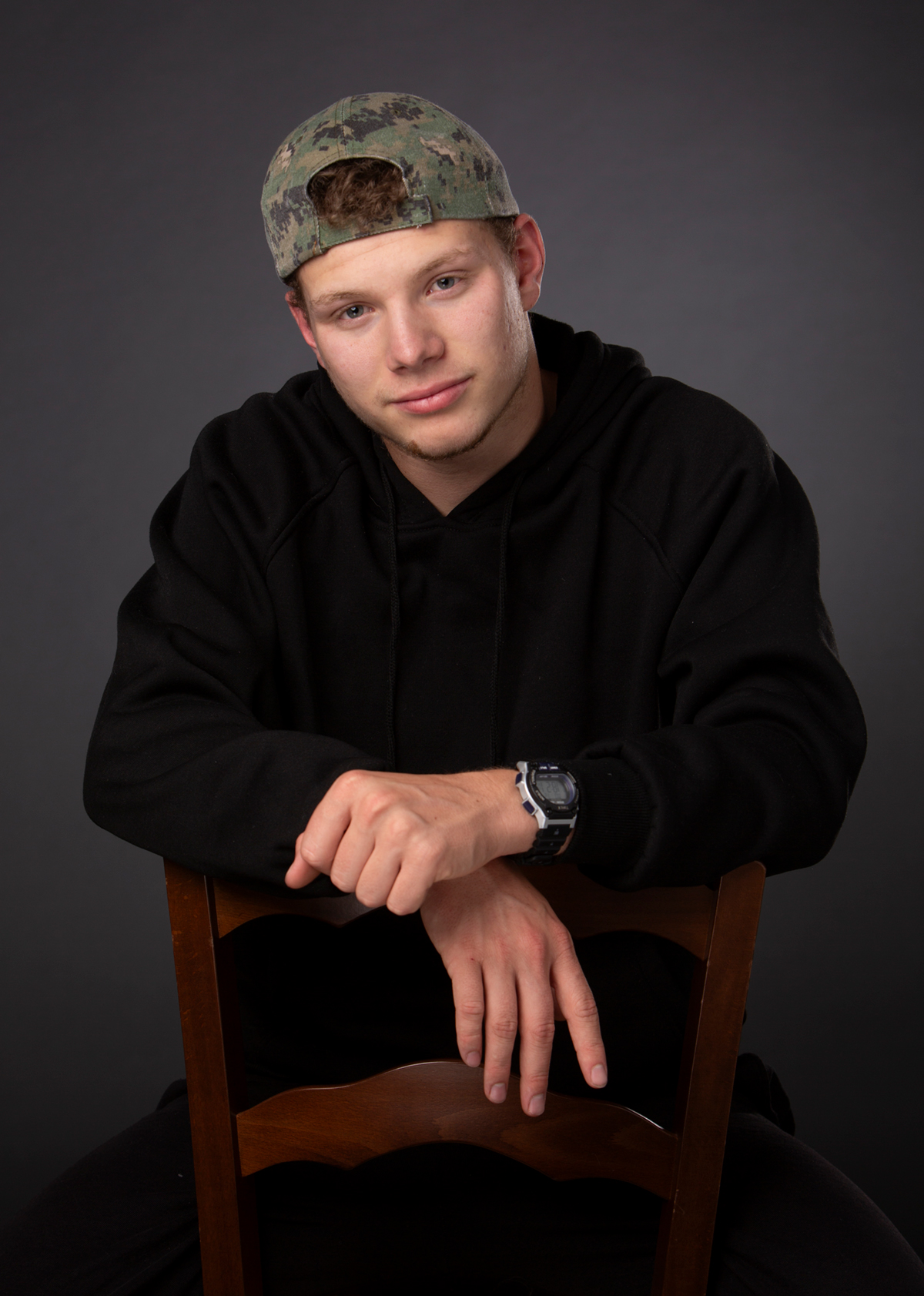 Teenager with baseball cap headshot