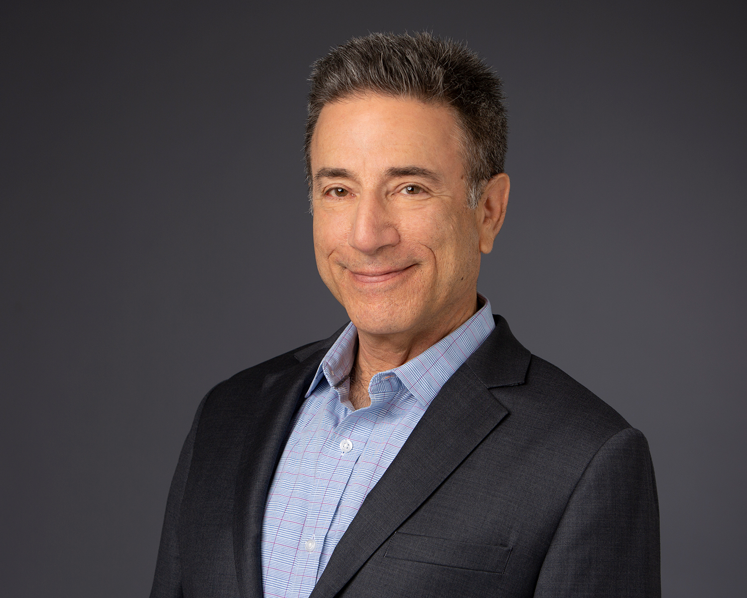 Studio headshot of comedian Mark Miller