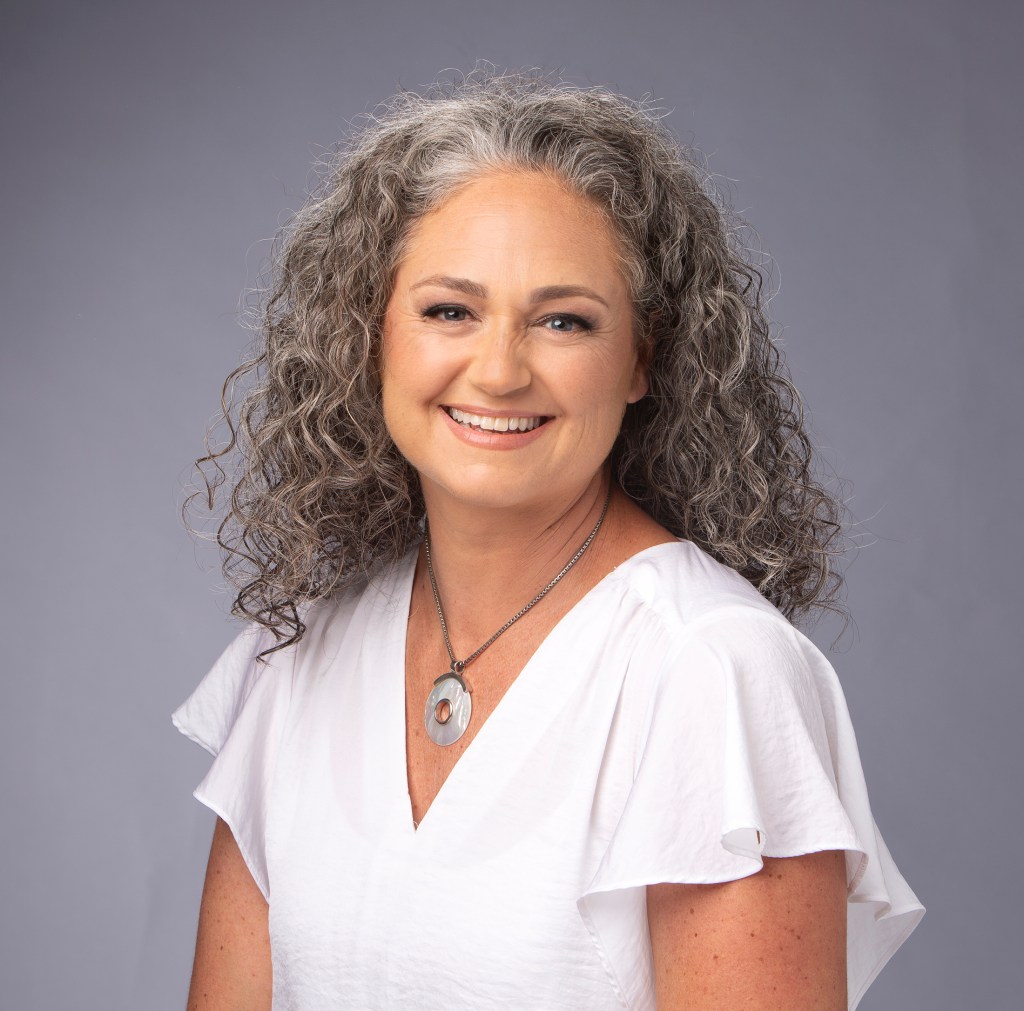 Headshot at Camera Creations Photography studio of Danika Frandsen owner of Baby Steps Concierge Nursing